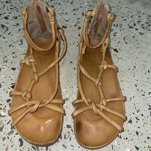 Free People strappy tan sandals with a zip closure in the back